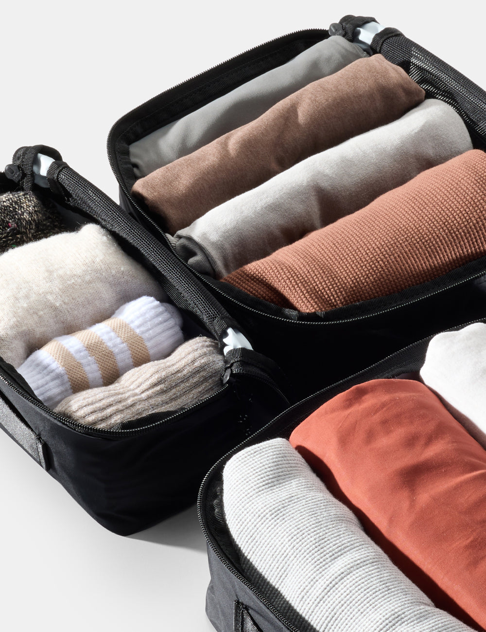 packing cubes with rolled up clothing