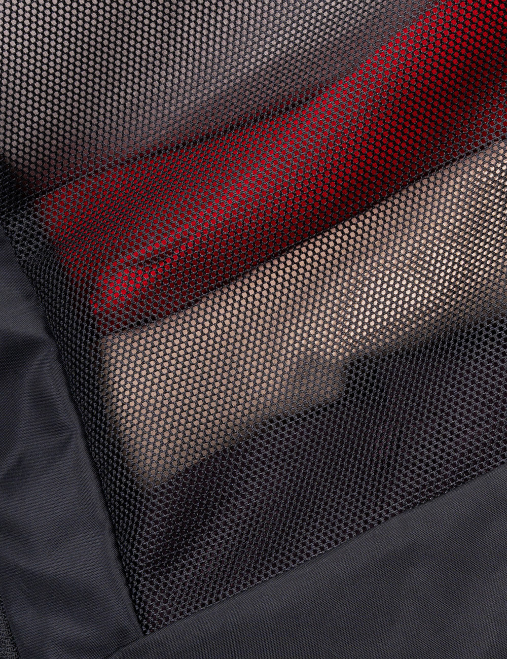 close up view of see through mesh with clothing behind it