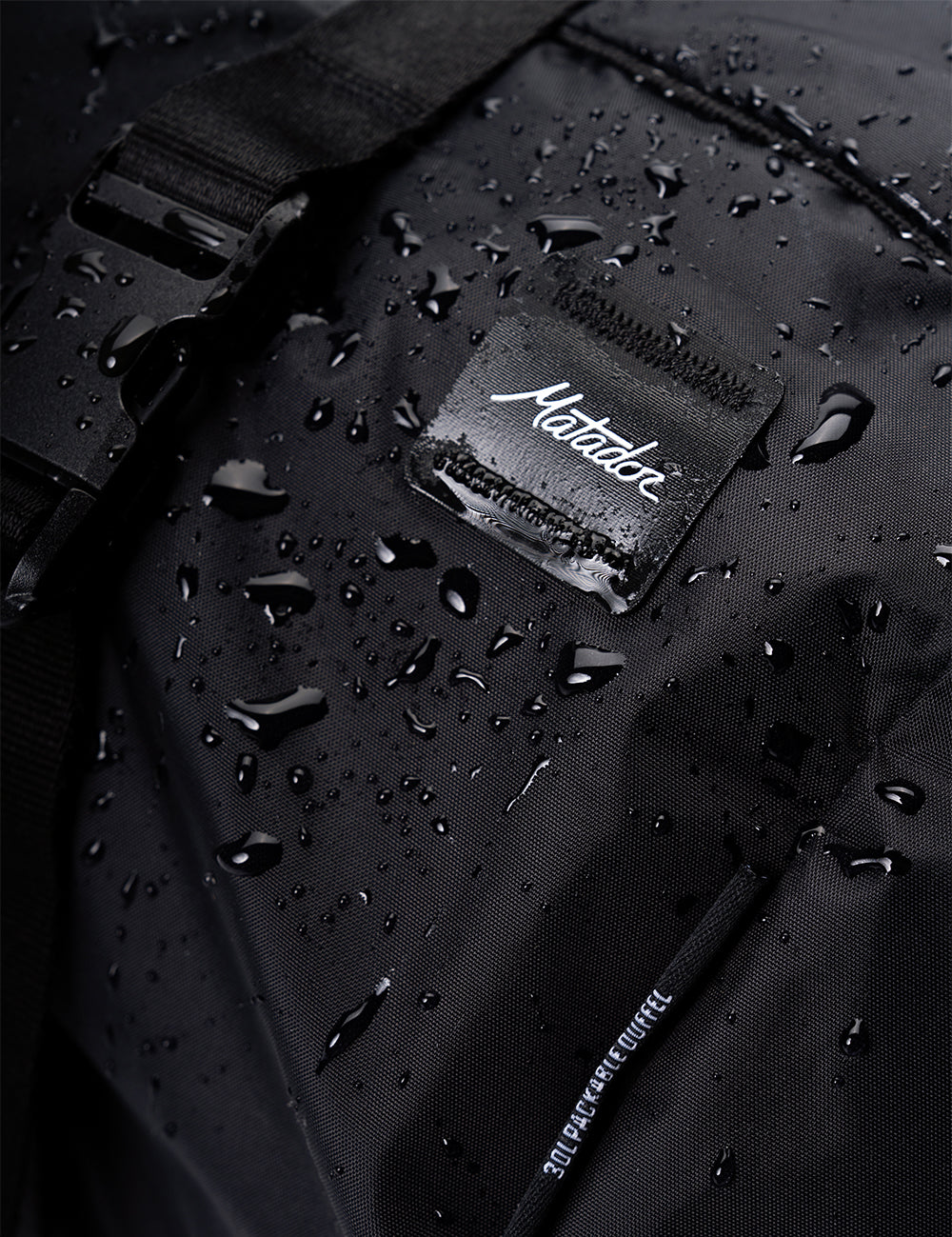 water droplets on black fabric