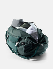 Green duffel bag on a light gray background