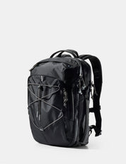 Black backpack on a light gray background