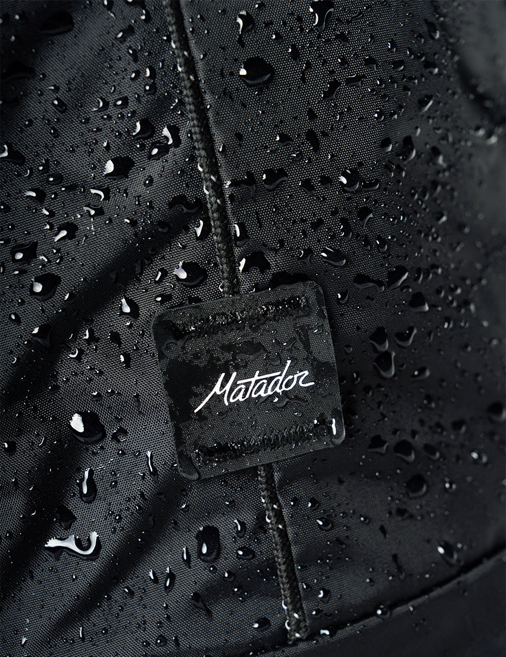 water droplets on black fabric