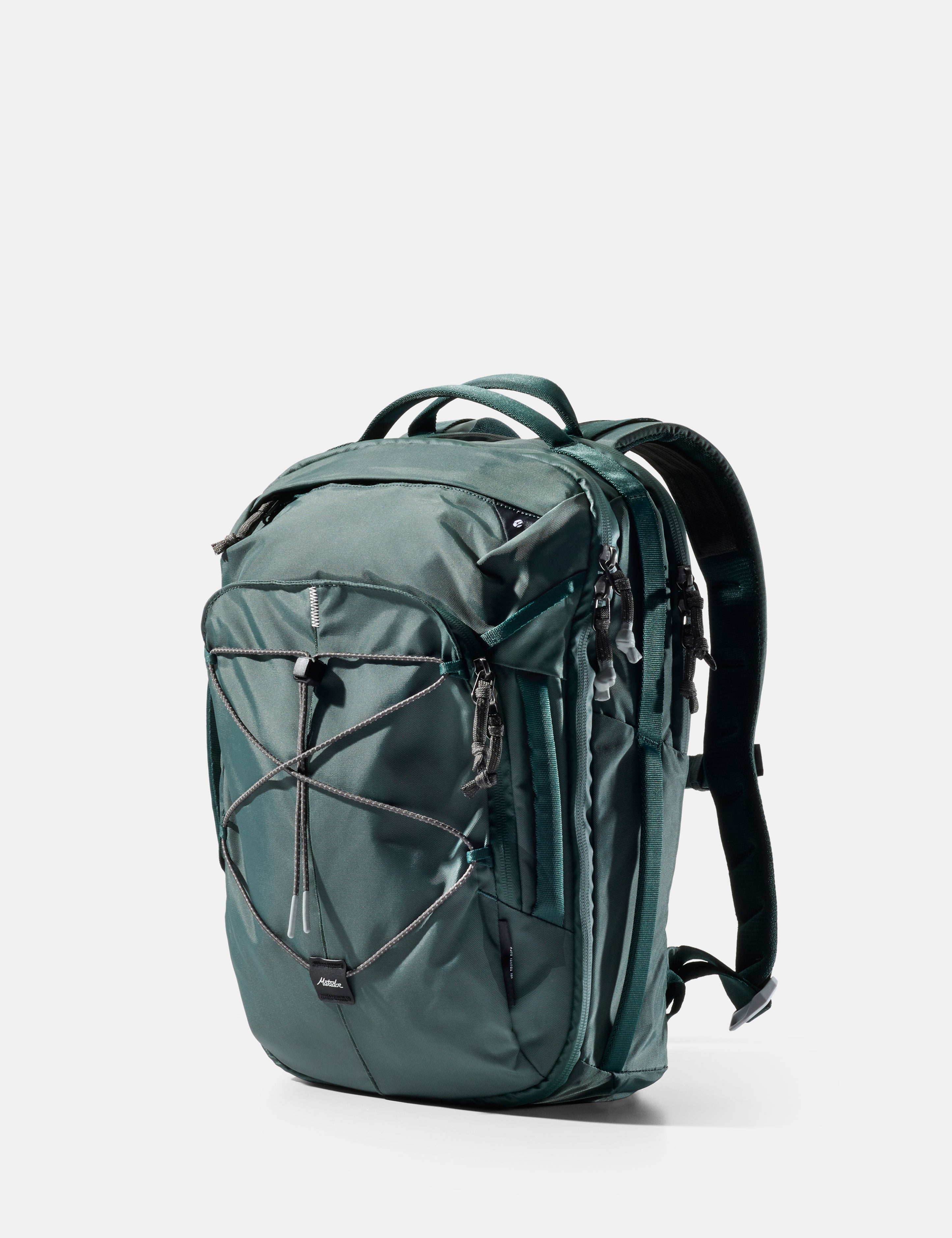 Green backpack on a light gray background