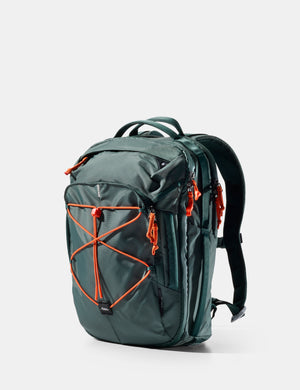 Green backpack with orange accents on a white background