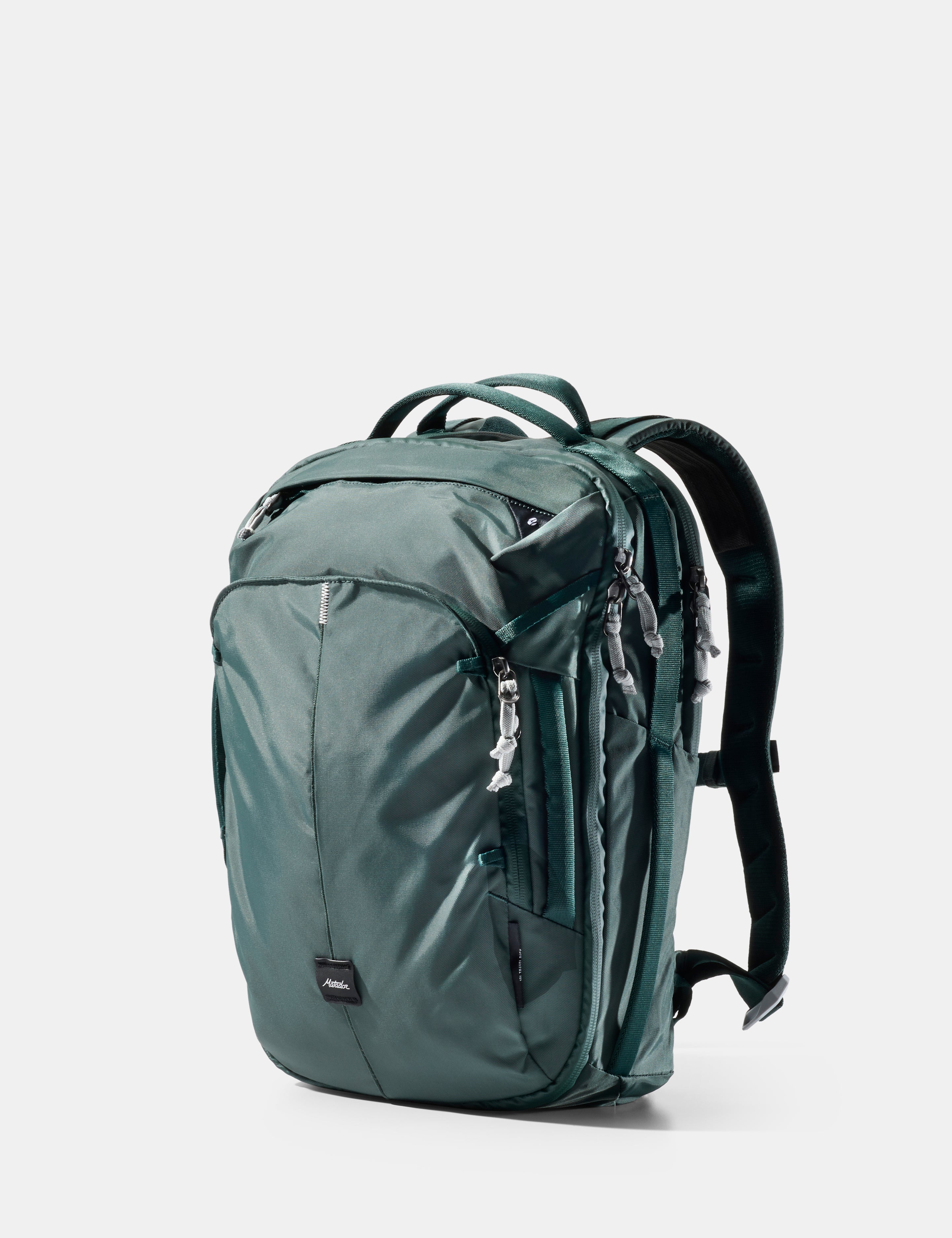 Green backpack on a light gray background