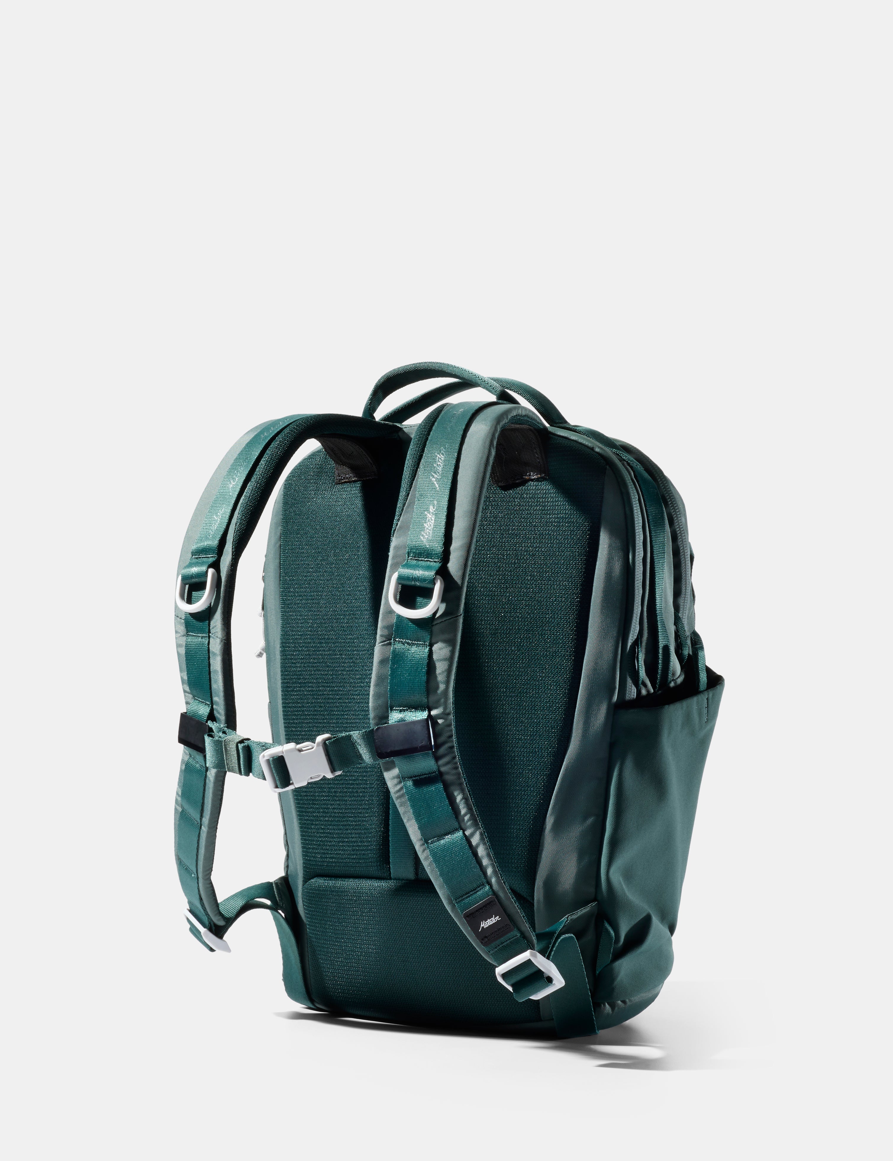 Green backpack on a white background