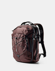garnet backpack with black straps on a white background