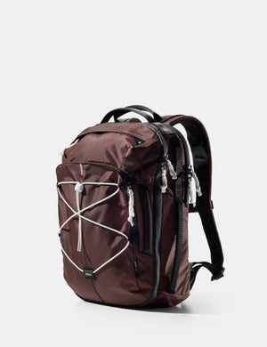 garnet backpack with white accents on a light gray background