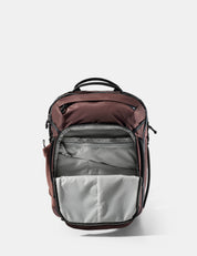 Backpack with garnet top section and gray bottom section on a white background