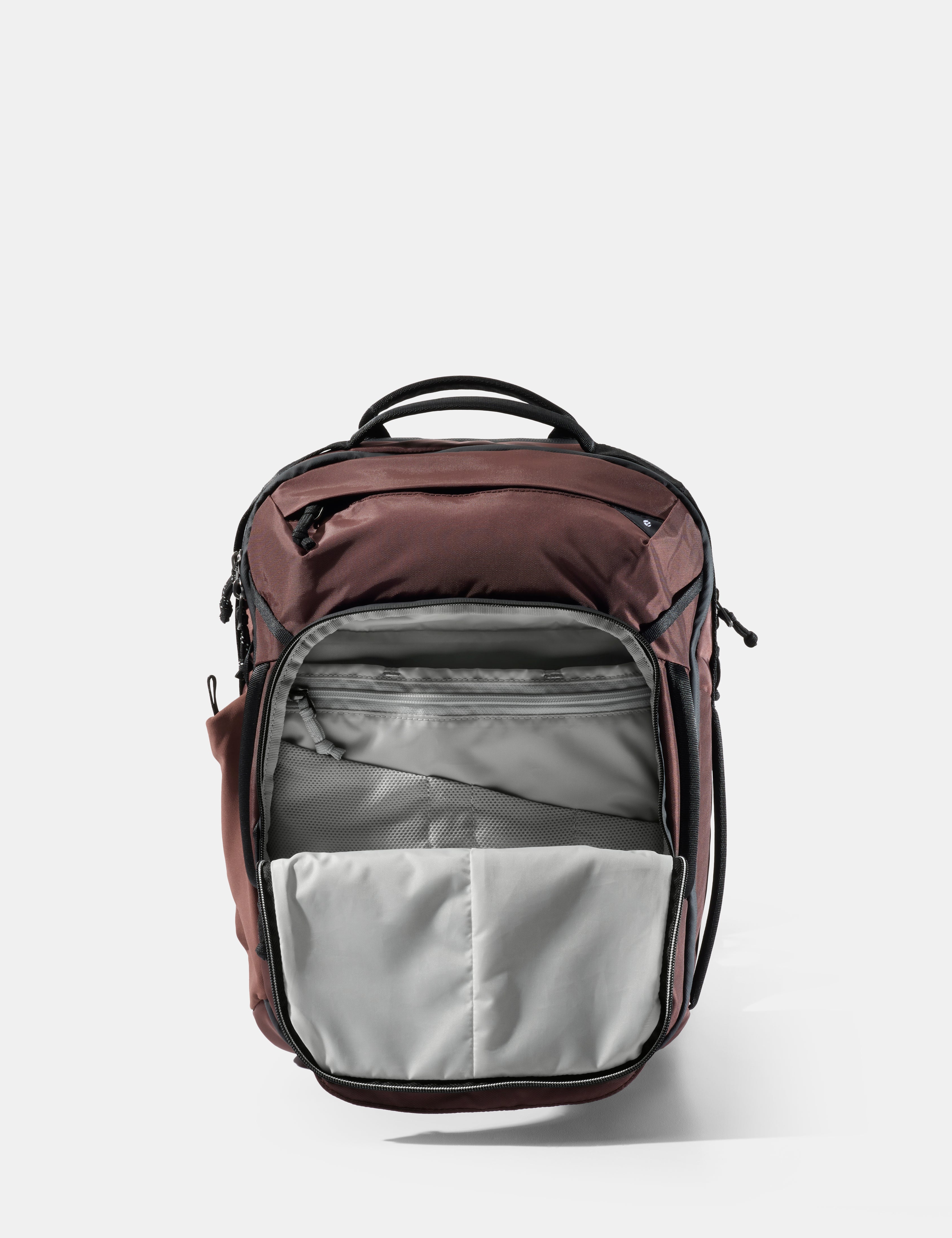 Backpack with garnet top section and gray bottom section on a white background