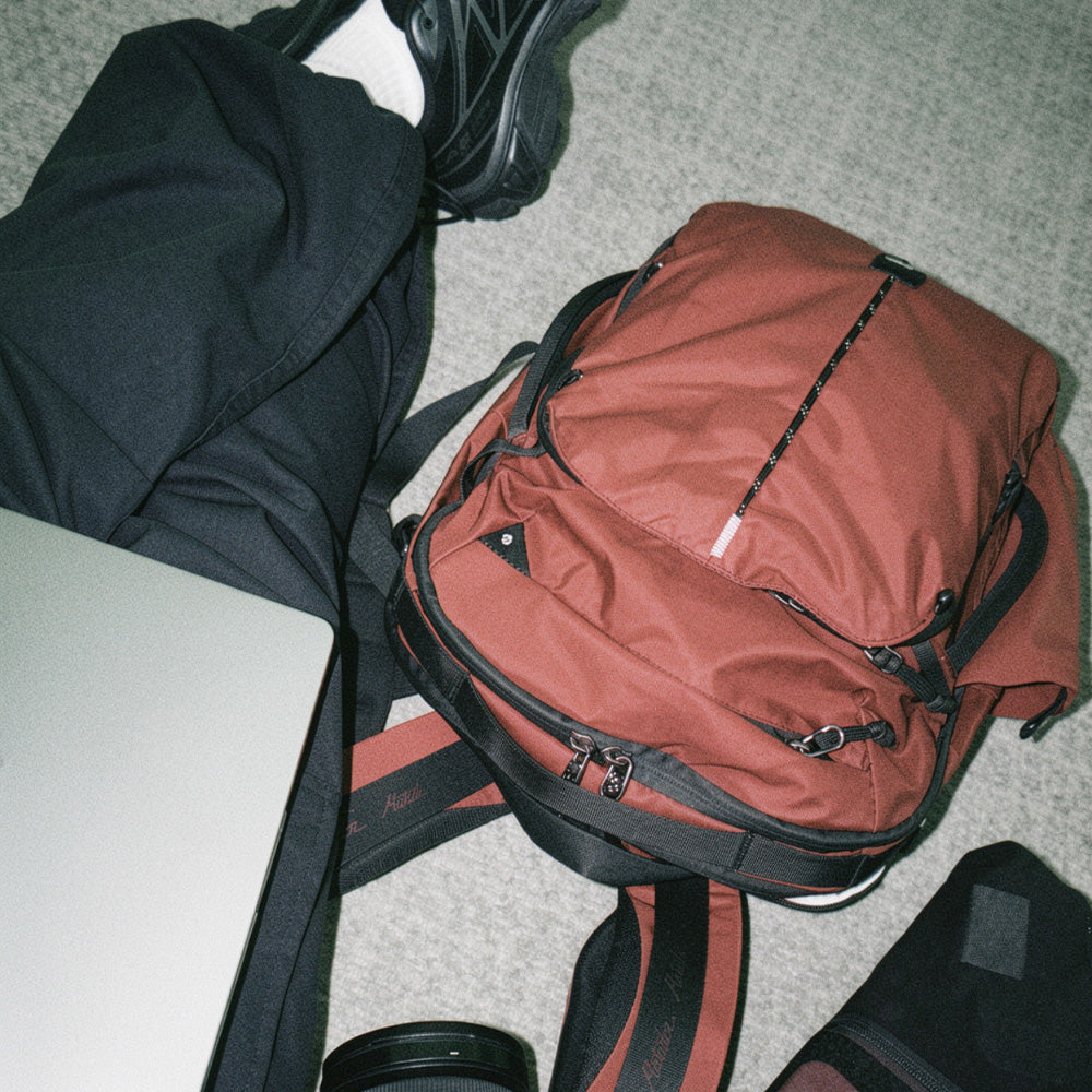red backpack on airport floor