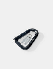 Black carabiner with a silver keys on a white background