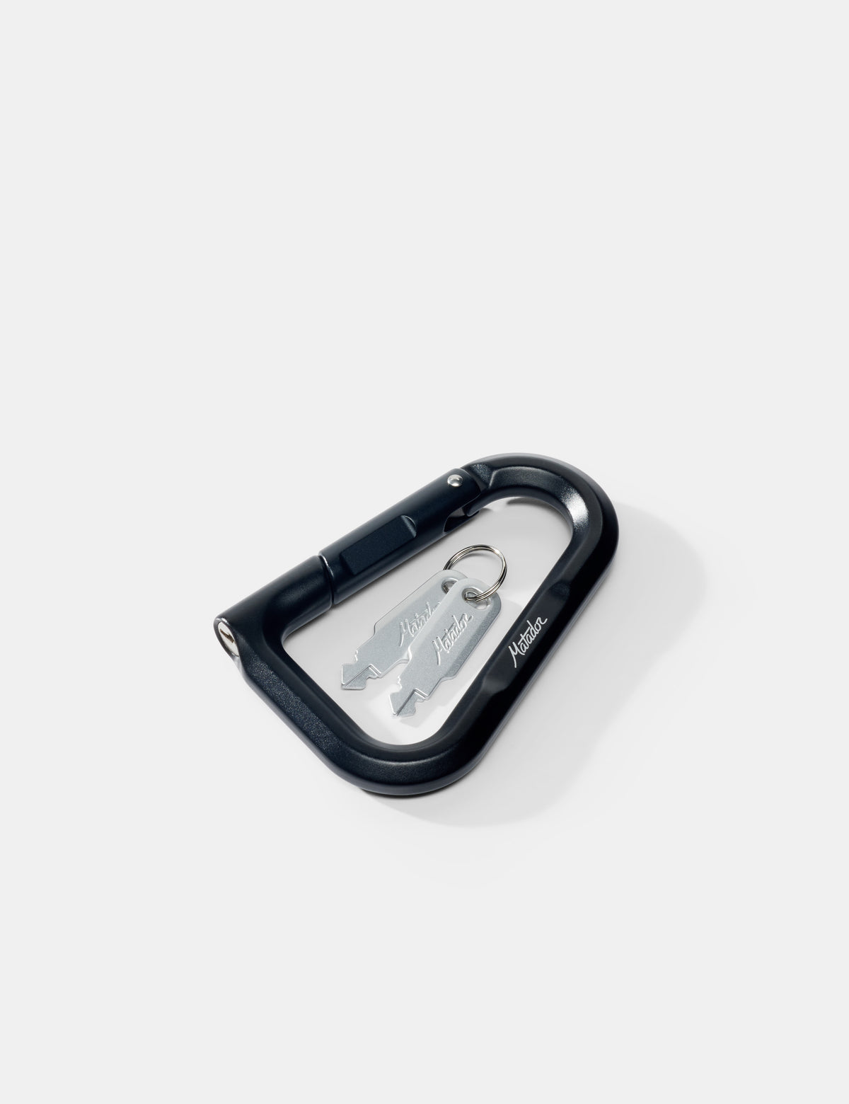Black carabiner with a silver keys on a white background