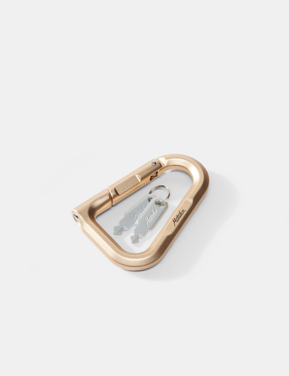 gold carabiner with keys on a white background