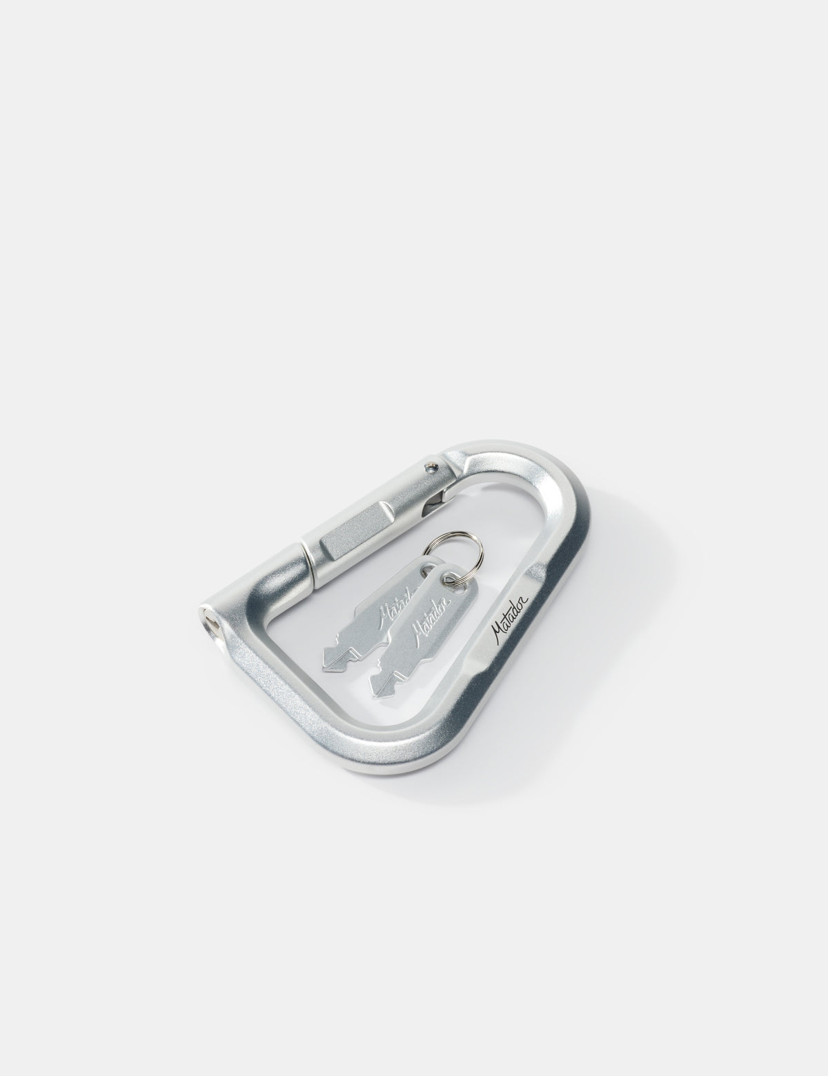 Metallic carabiner with keys on a white background