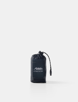 Black drawstring pouch with brand logo on a white background