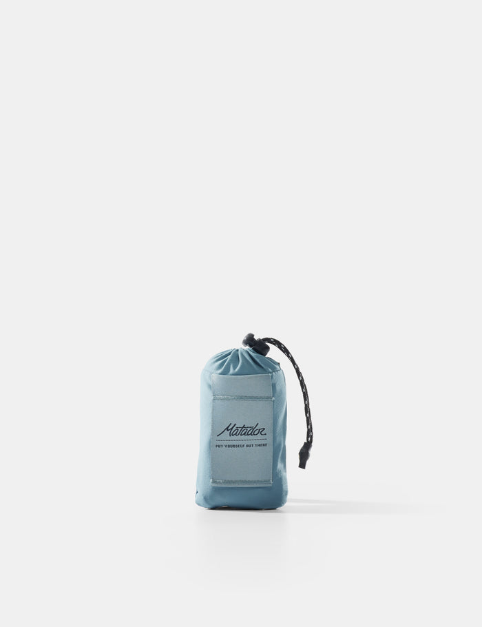 Blue drawstring pouch with brand logo on a white background