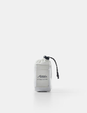 White drawstring bag with black branding on a white background