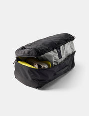 Black duffel bag with open top showing gray interior on a white background