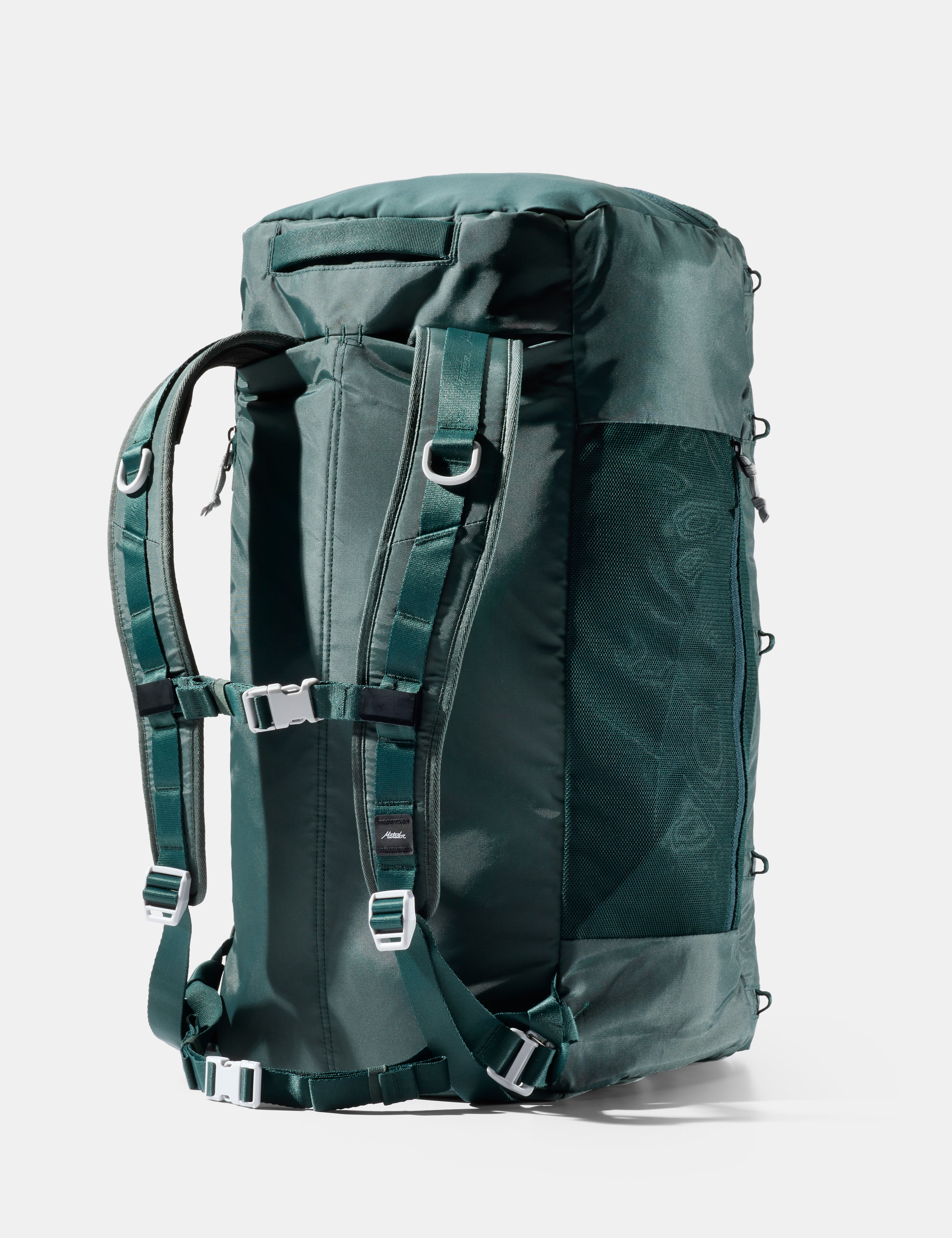 Green backpack with multiple straps on a white background