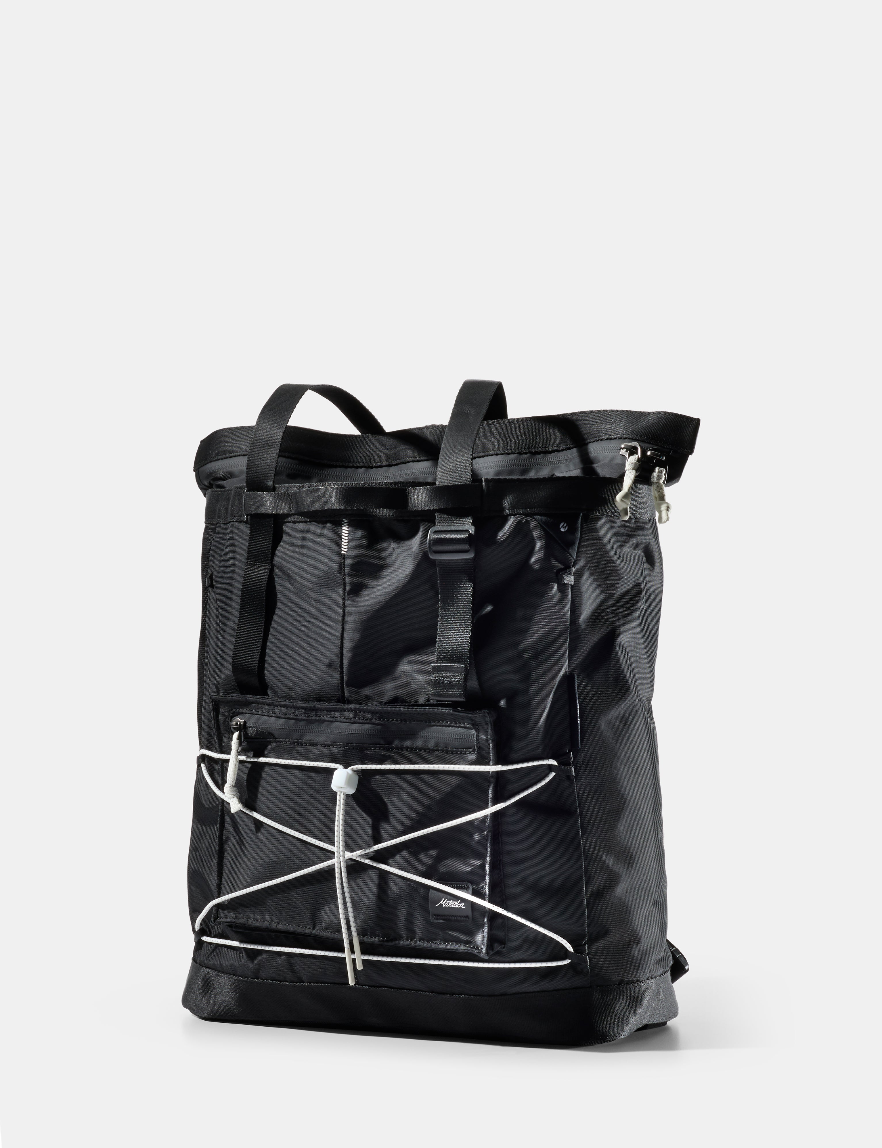 Black tote with white accents on a light gray background
