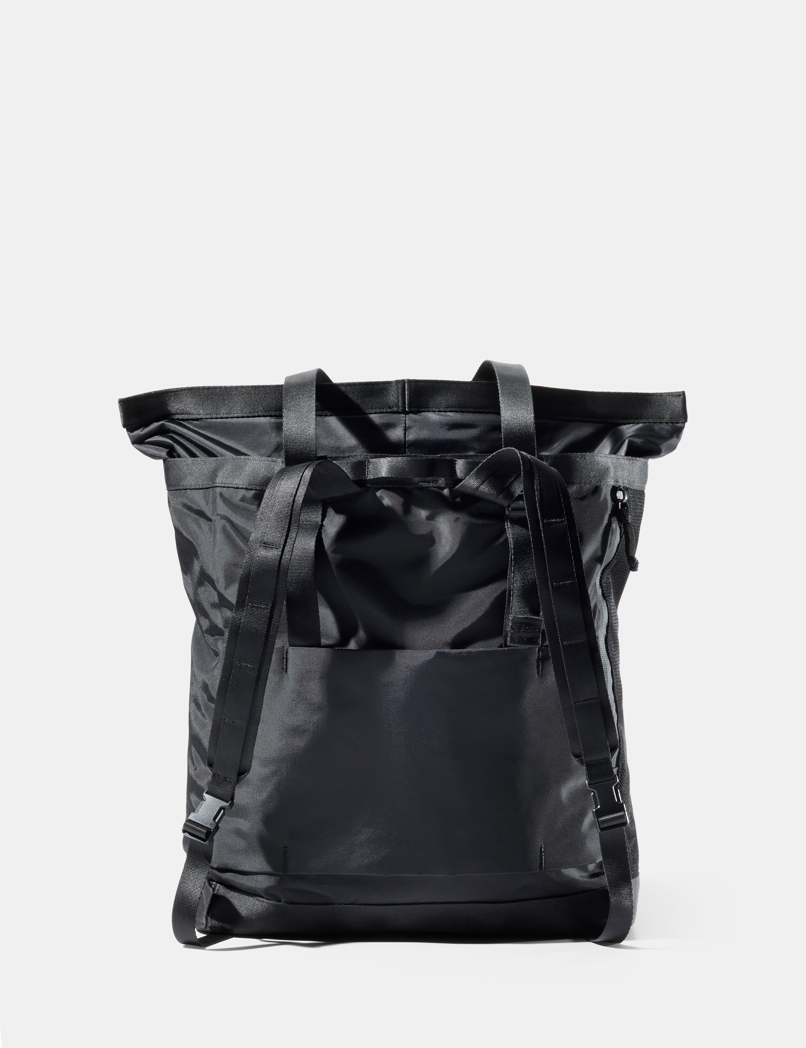 Black tote pack on a light gray background