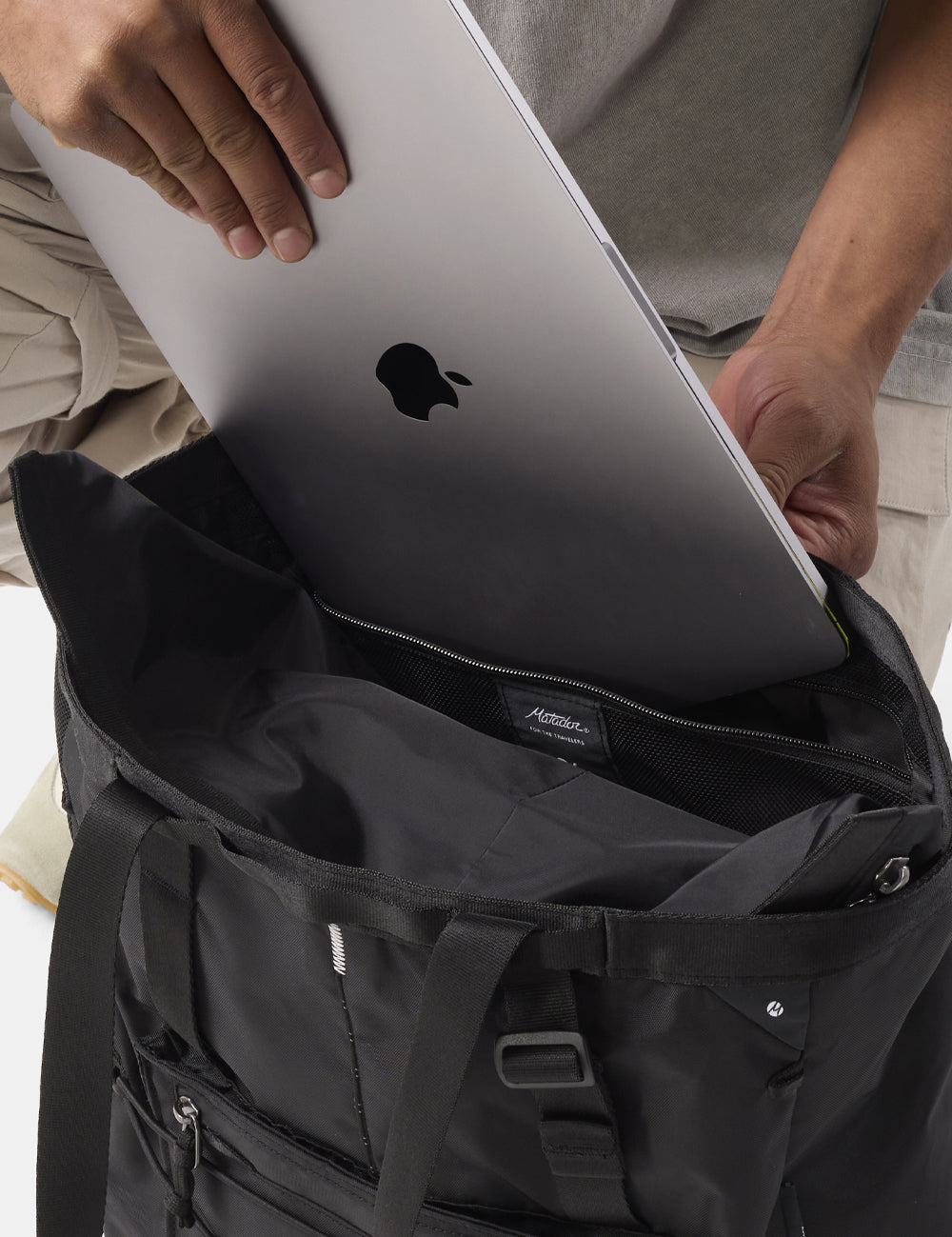 laptop being placed in black tote