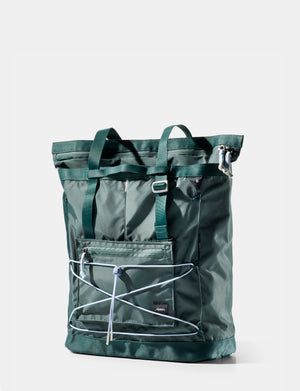 Green backpack with a white background