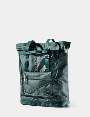 Green tote bag with multiple pockets on a white background