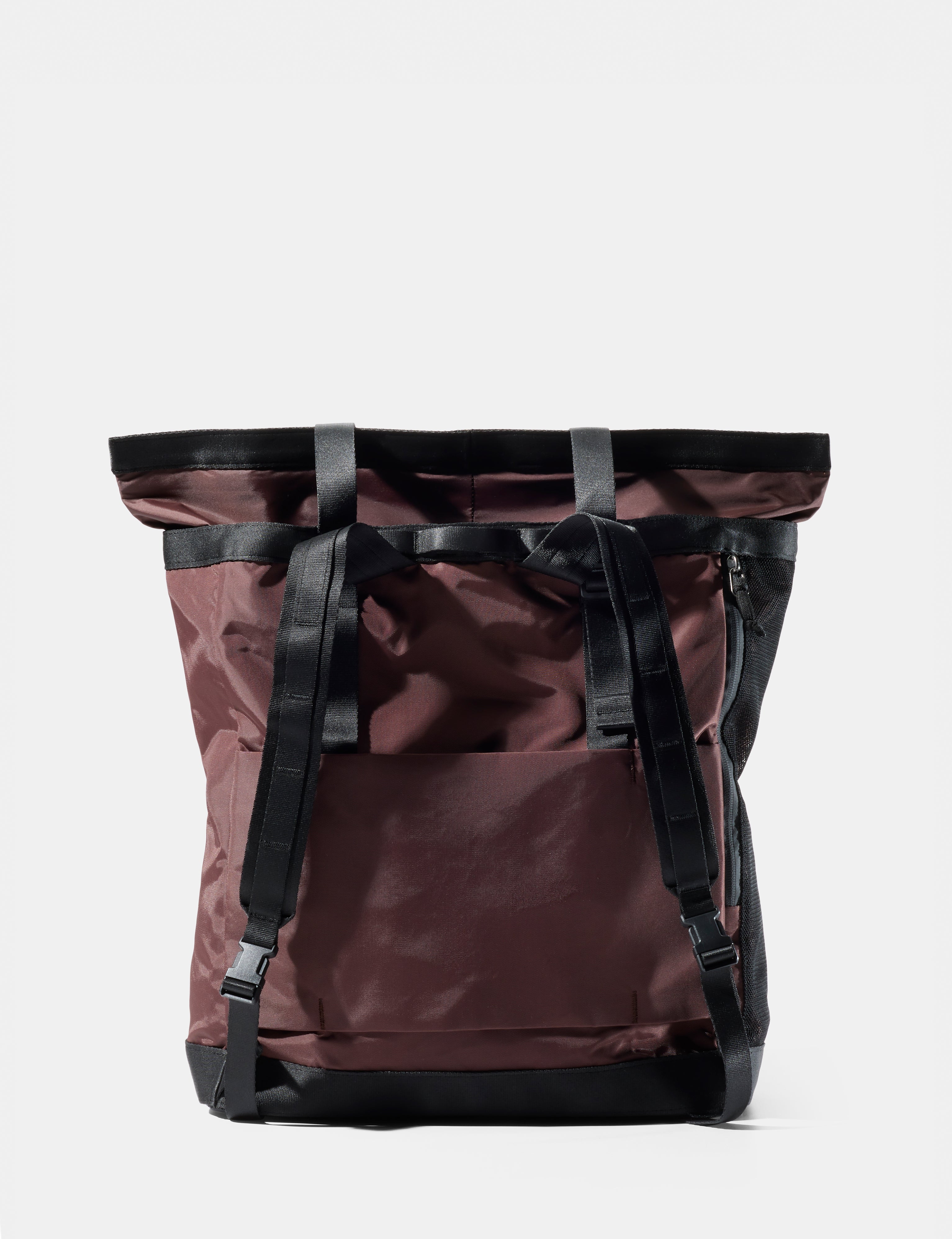 garnet  backpack with black straps on a white background