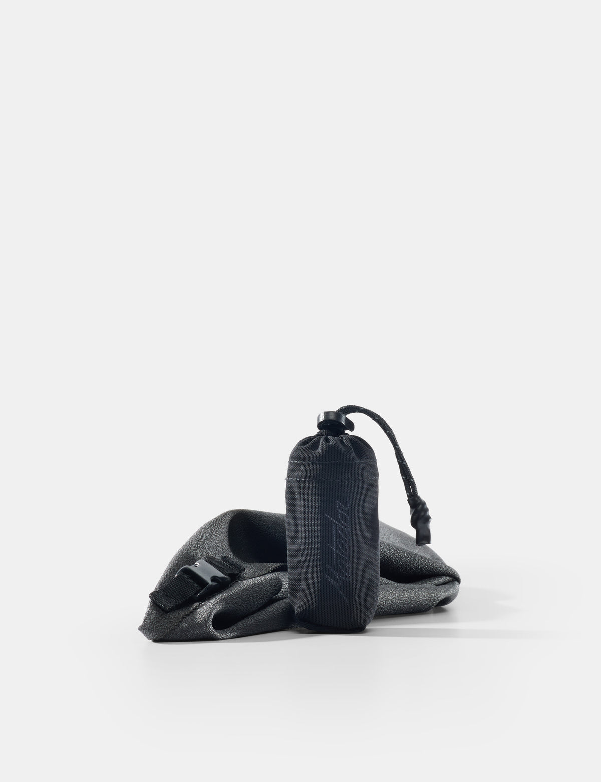 gray towel and pouch on a white background