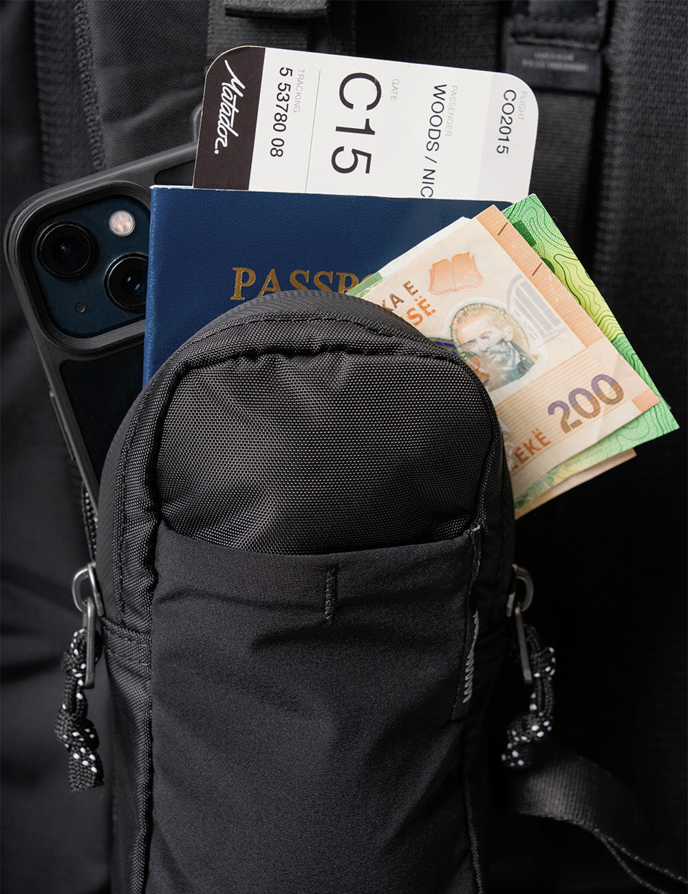 black speed stash with money, passport, ticket and phone