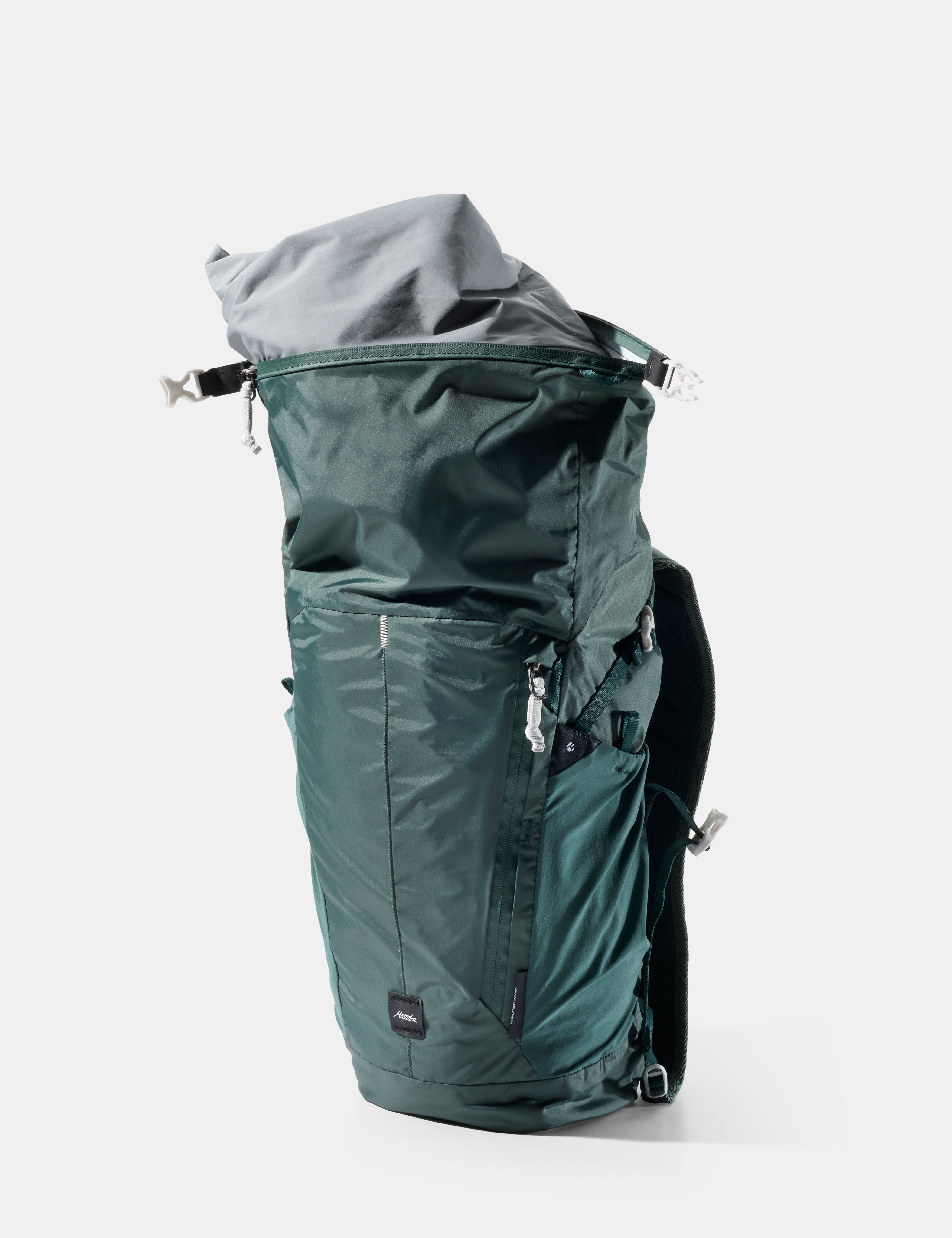 Green backpack with open top on a white background