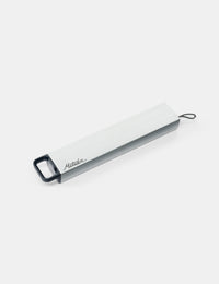 Metal pill canister on a white background