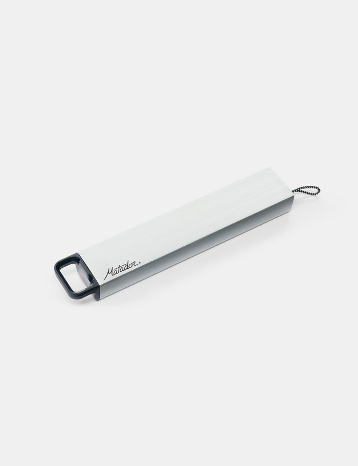 Metal pill canister on a white background