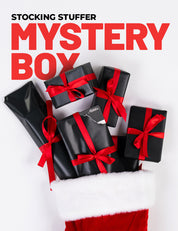 Black gift boxes with red ribbons on a white background with text 'Stocking Stuffer Mystery Box'.