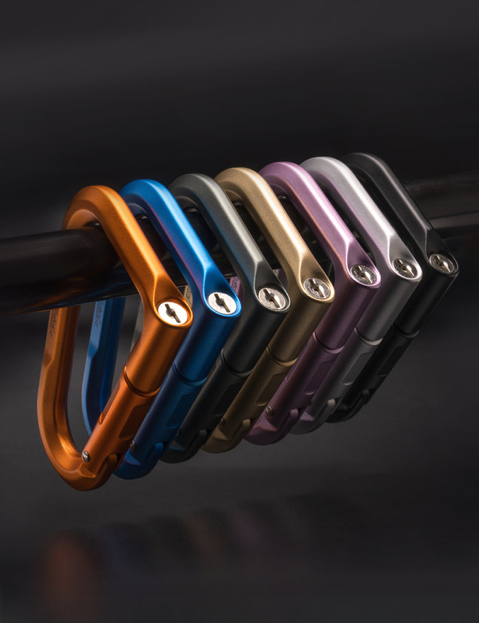 7 betalock carabiners on dark background
