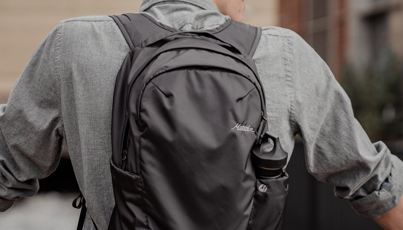 Close up view of man wearing On-Grid Backpack