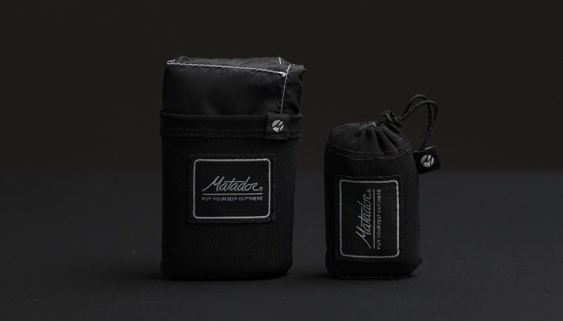 Black pocket blanket and pocket blanket mini on black background