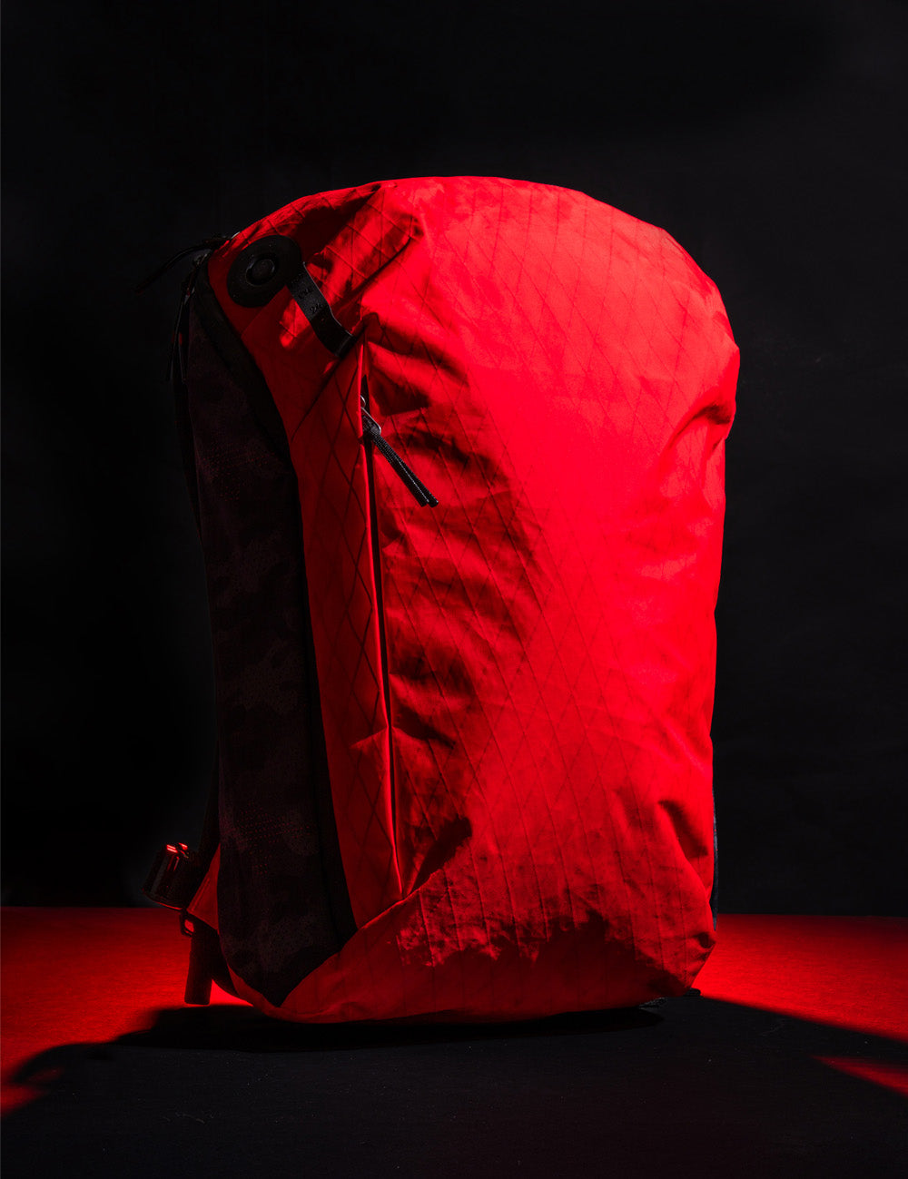 red backpack on dark background