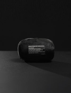 Black mesh pouch with text on a black background