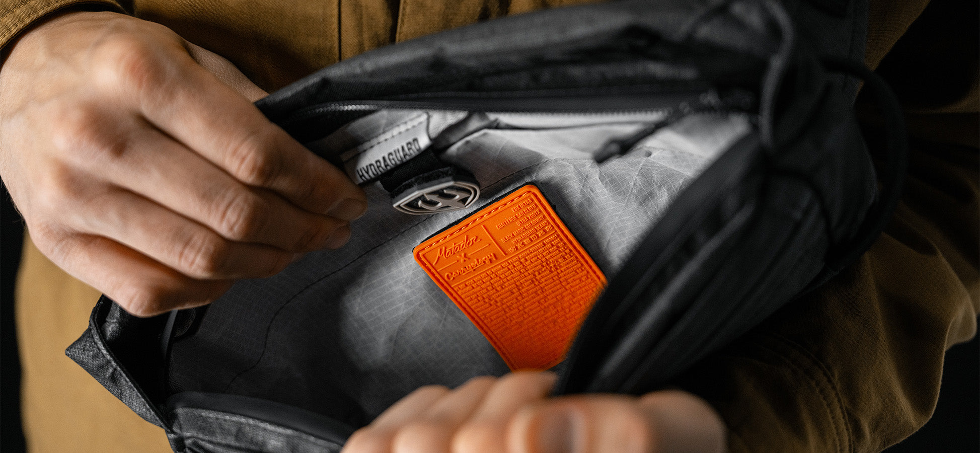 inside view of black sling, showing orange patch