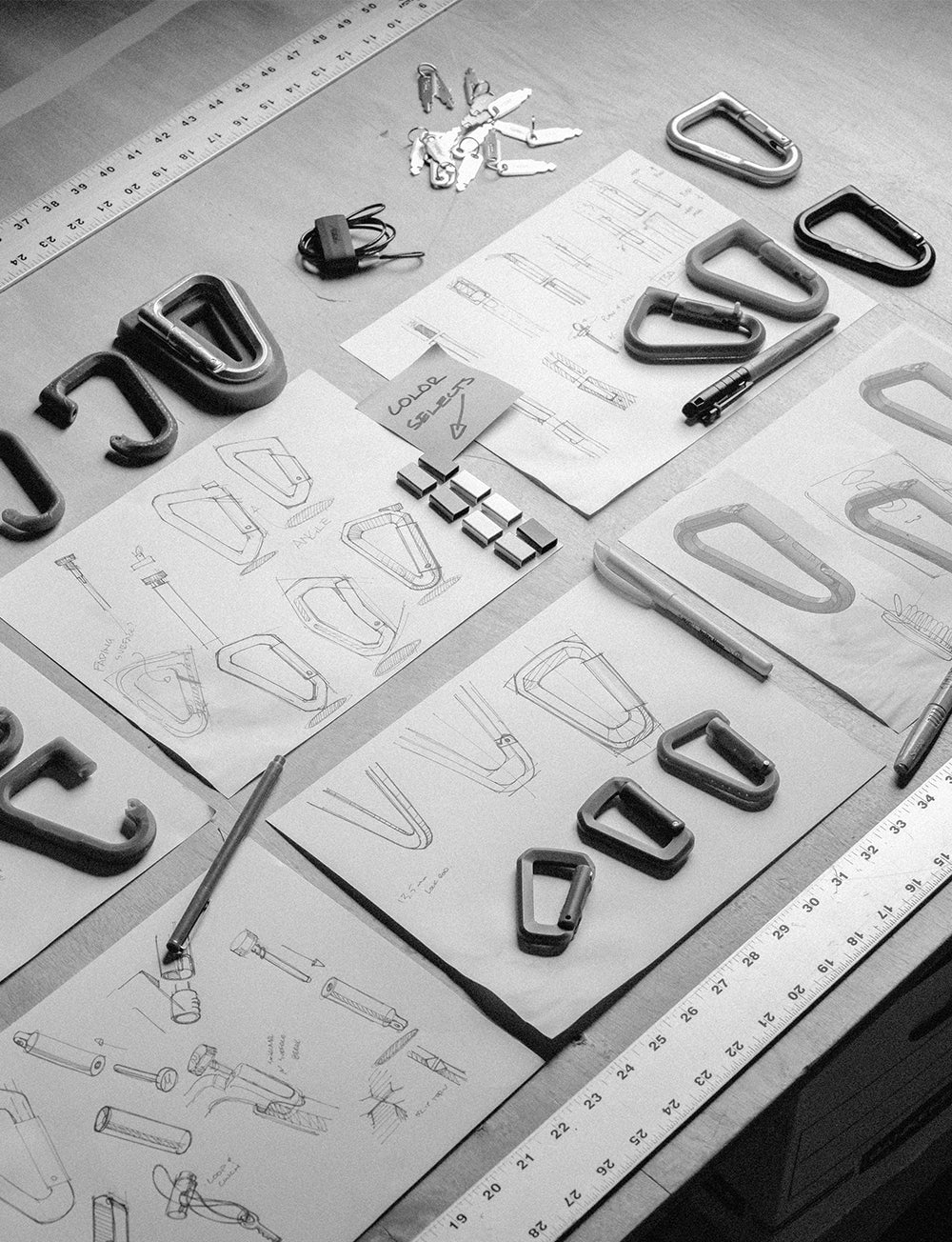 black and white image of carabiner drawings and prototypes