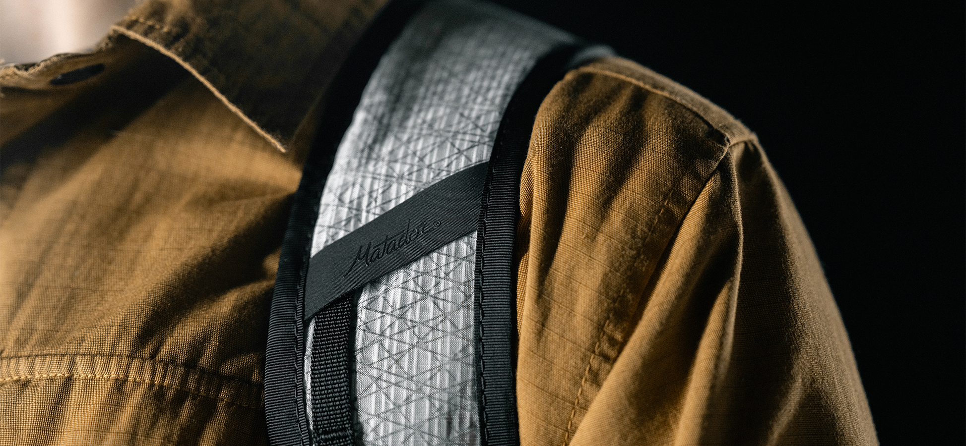 detail shot of matador logo on white backpack strap