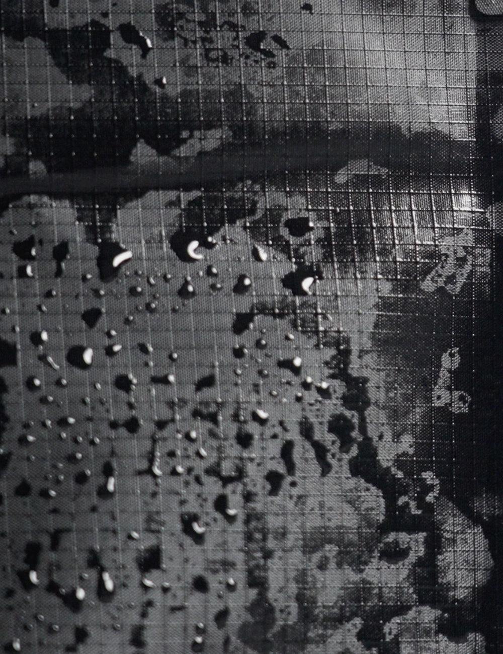 water droplets on black grid material