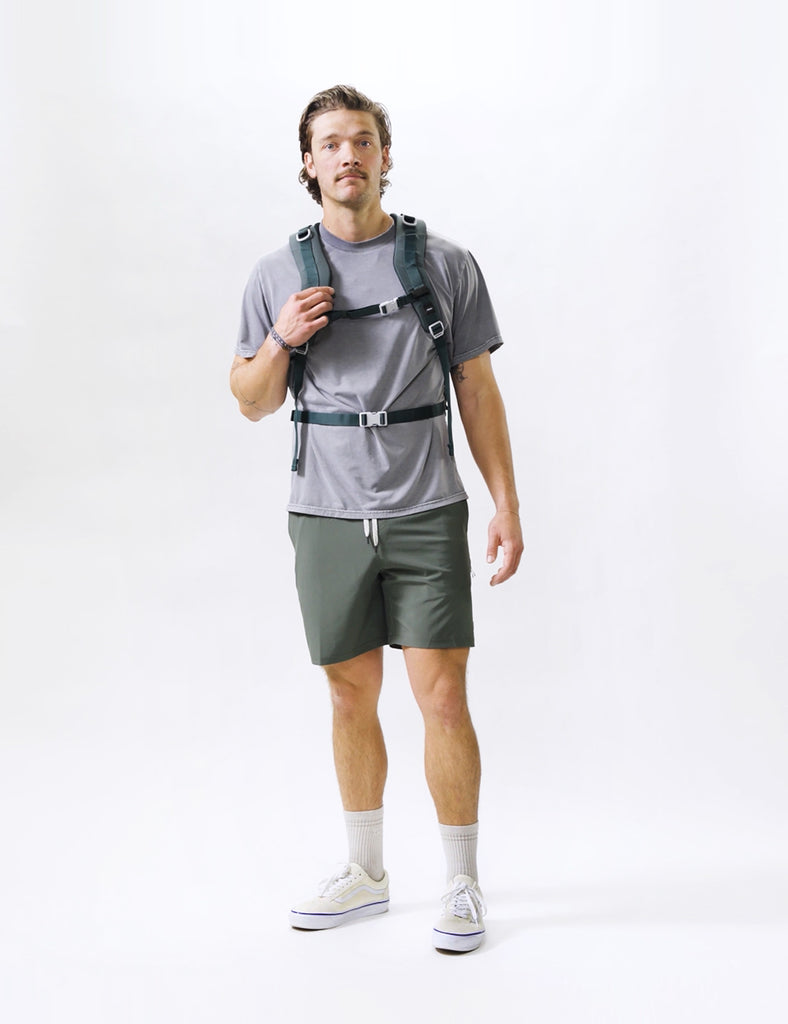 video of man wearing juniper backpack on white background