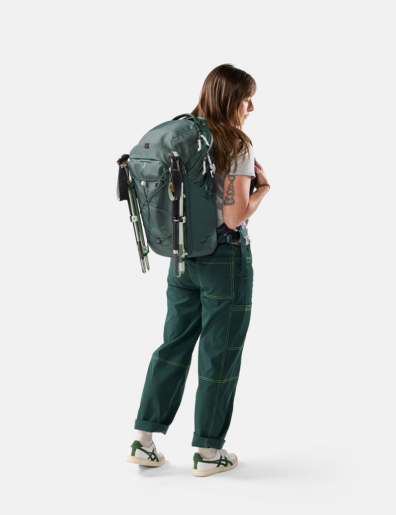 video of woman wearing juniper backpack with hiking poles