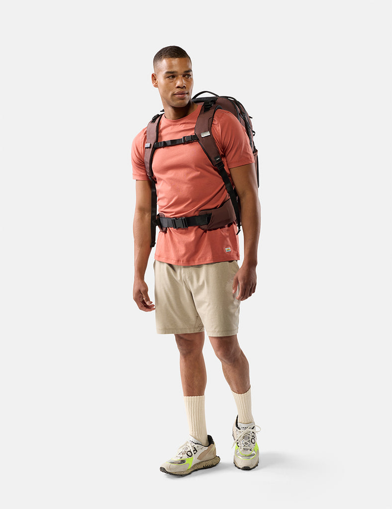 video of man wearing a garnet backpack