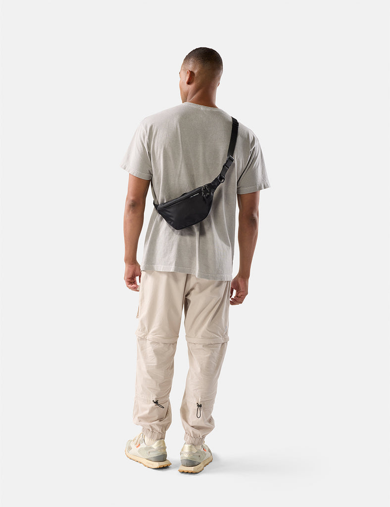 video of man wearing black sling