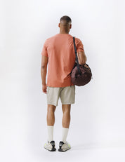 video of man wearing garnet duffel
